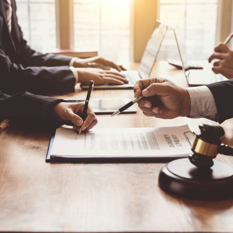 Mobile notary facilitating a professional loan signing with legal documents and notary stamp.